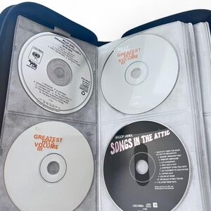 29 CDs with Music 70's -90's in a 72 Slot CD/DVD Zip Around Case